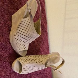 Beige suede sandals.